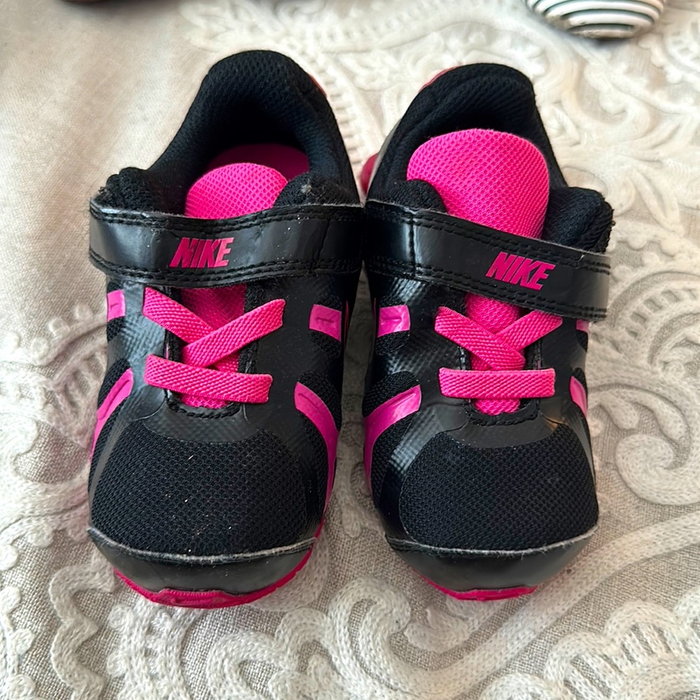 Black and pink Nike shoes